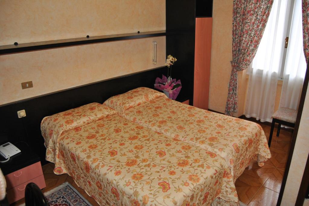 Postel nebo postele na pokoji v ubytování Hotel Villa Mon Toc