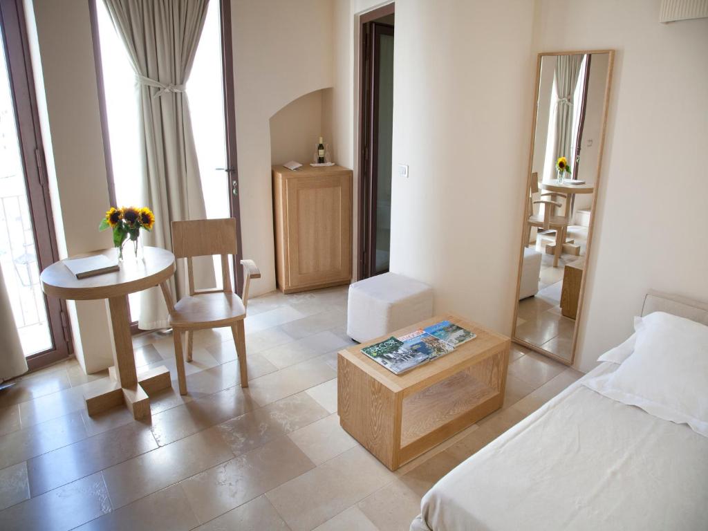 Кровать или кровати в номере La Sommità Relais & Chateaux
