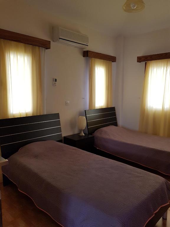 Postel nebo postele na pokoji v ubytování Olgas Villa