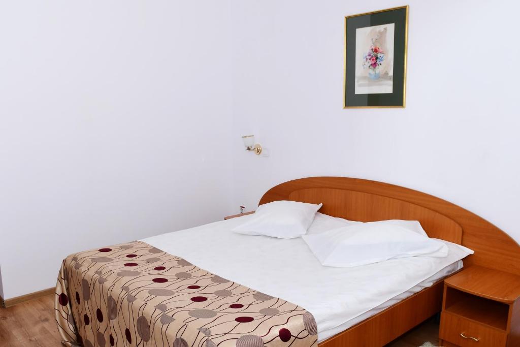 Postel nebo postele na pokoji v ubytování Hotel Select