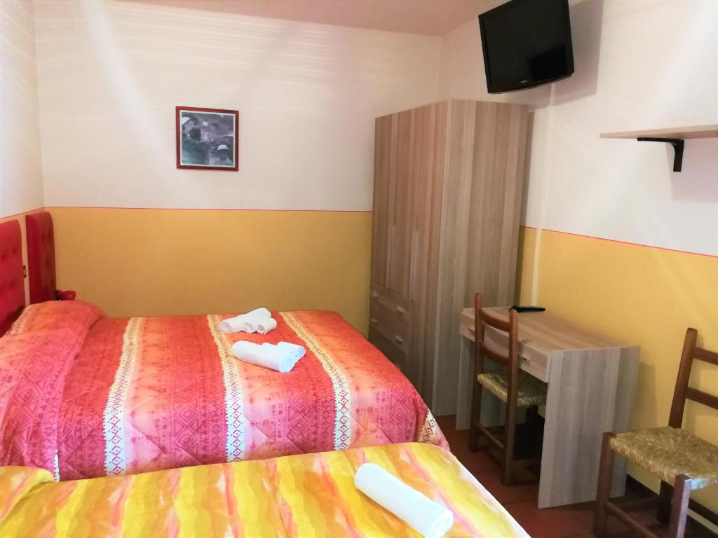 Postel nebo postele na pokoji v ubytování Agriturismo Longetti
