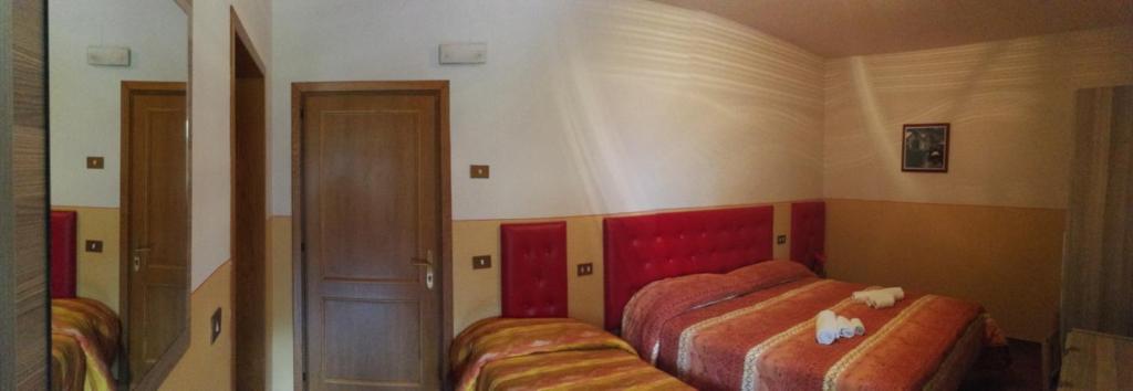 Postel nebo postele na pokoji v ubytování Agriturismo Longetti