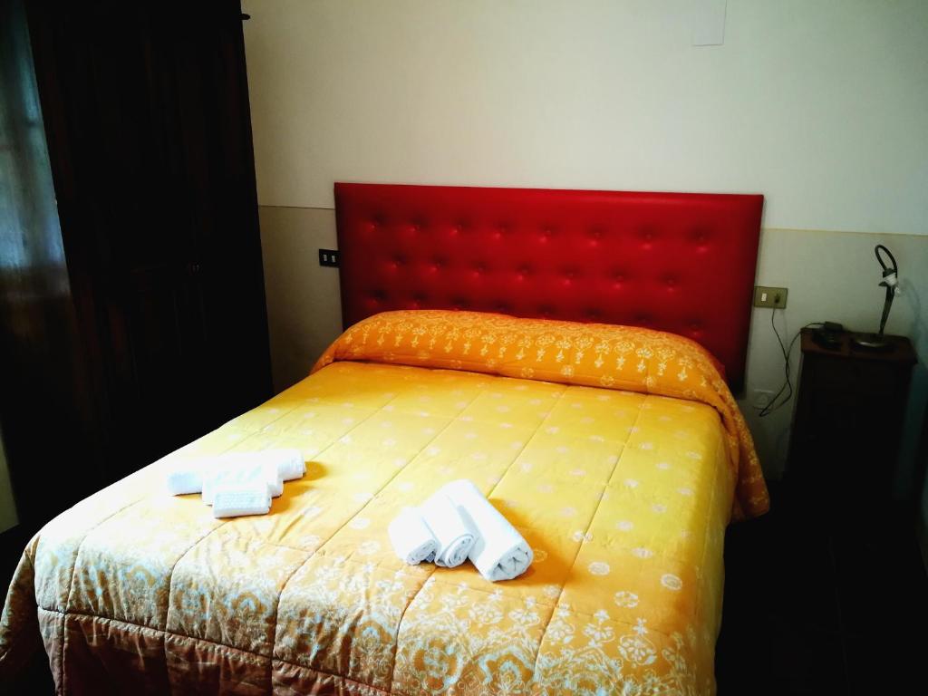 Postel nebo postele na pokoji v ubytování Agriturismo Longetti