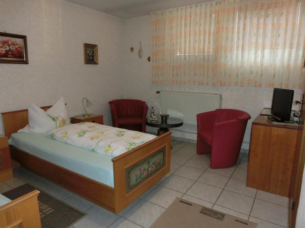 Postel nebo postele na pokoji v ubytování Pfaelzer Stuben