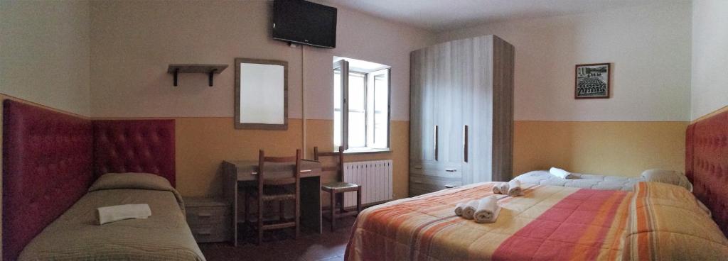 Postel nebo postele na pokoji v ubytování Agriturismo Longetti