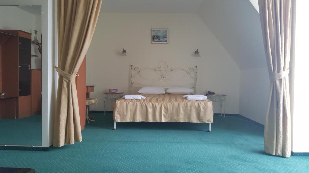 Postel nebo postele na pokoji v ubytování Hotel Melody