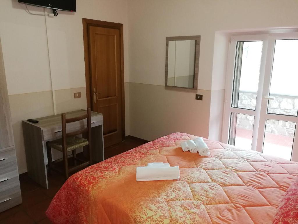 Postel nebo postele na pokoji v ubytování Agriturismo Longetti