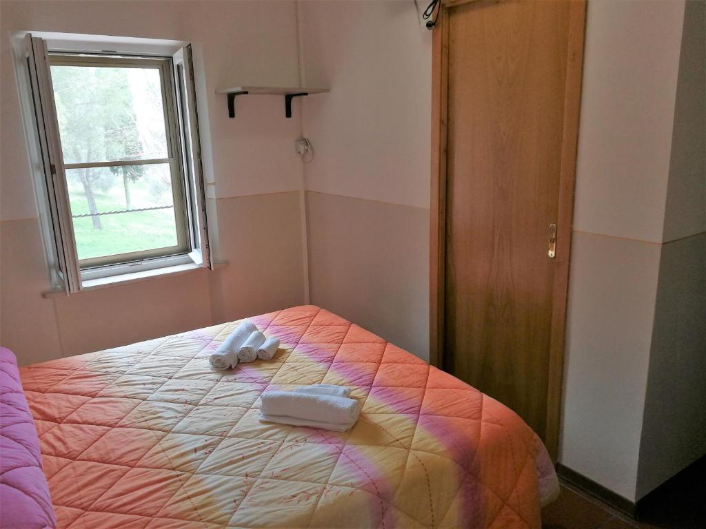 Postel nebo postele na pokoji v ubytování Agriturismo Longetti