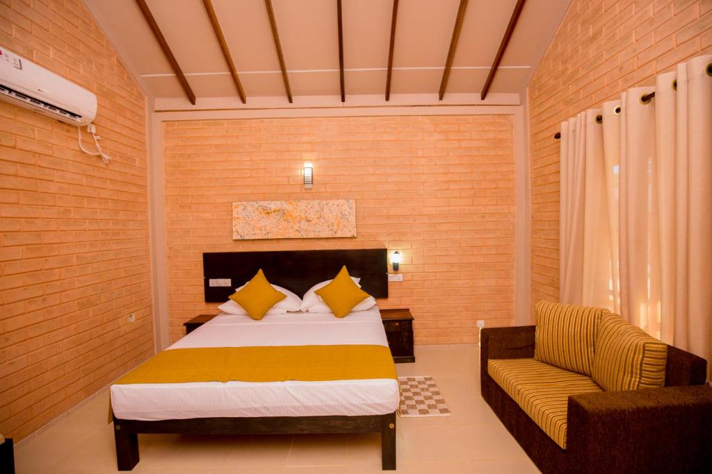 เตียงในห้องที่ Tringa Villas Yala