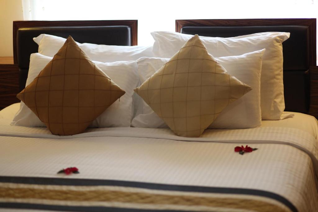 Postel nebo postele na pokoji v ubytování Elite Central Hotel Hanoi