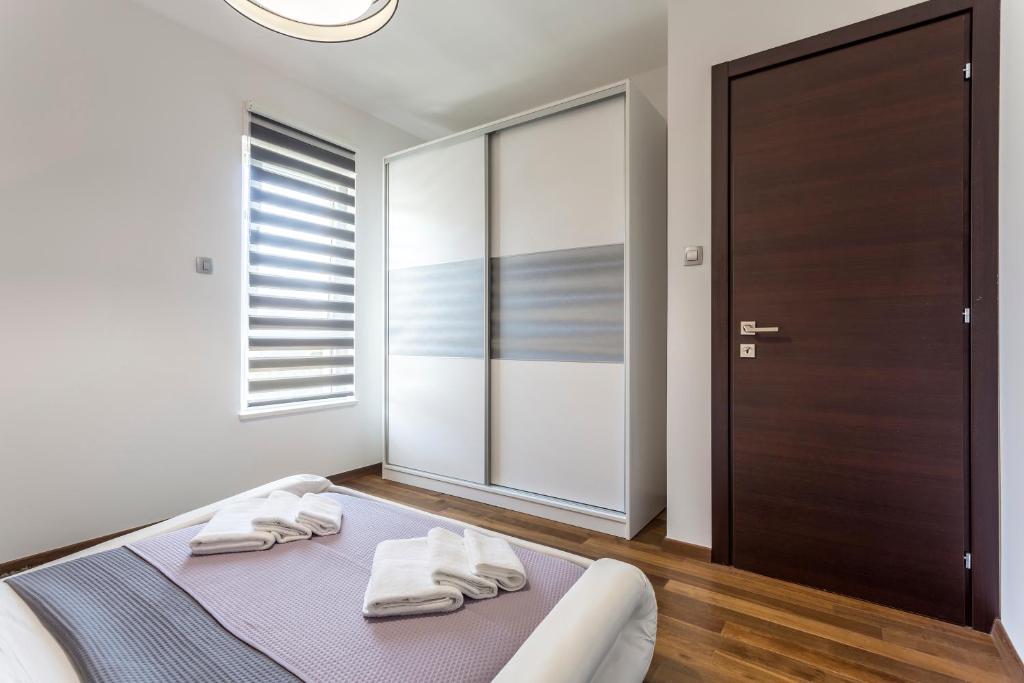 Posteľ alebo postele v izbe v ubytovaní Sea Pearl Luxury Apartment