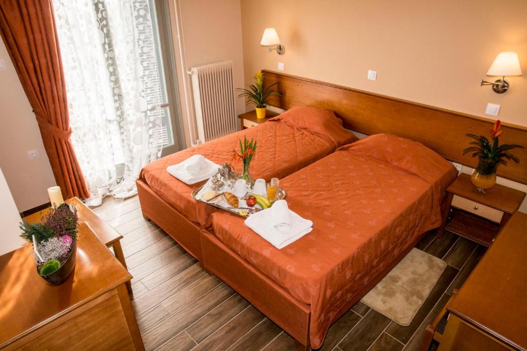 Postel nebo postele na pokoji v ubytování Togias Hotel