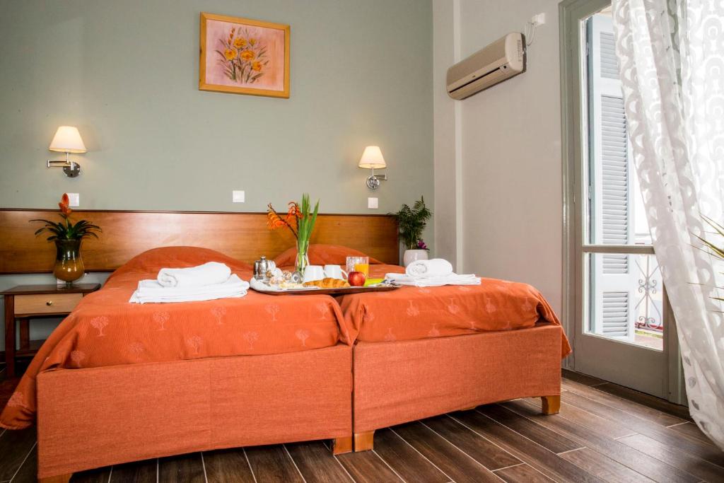 Postel nebo postele na pokoji v ubytování Togias Hotel