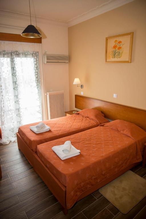 Postel nebo postele na pokoji v ubytování Togias Hotel