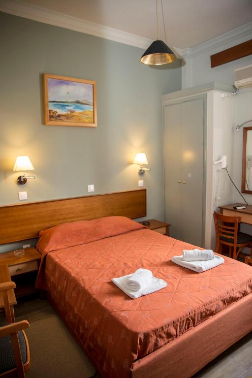 Postel nebo postele na pokoji v ubytování Togias Hotel