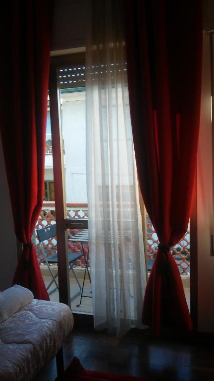 Łóżko lub łóżka w pokoju w obiekcie Florinda B&B Viareggio