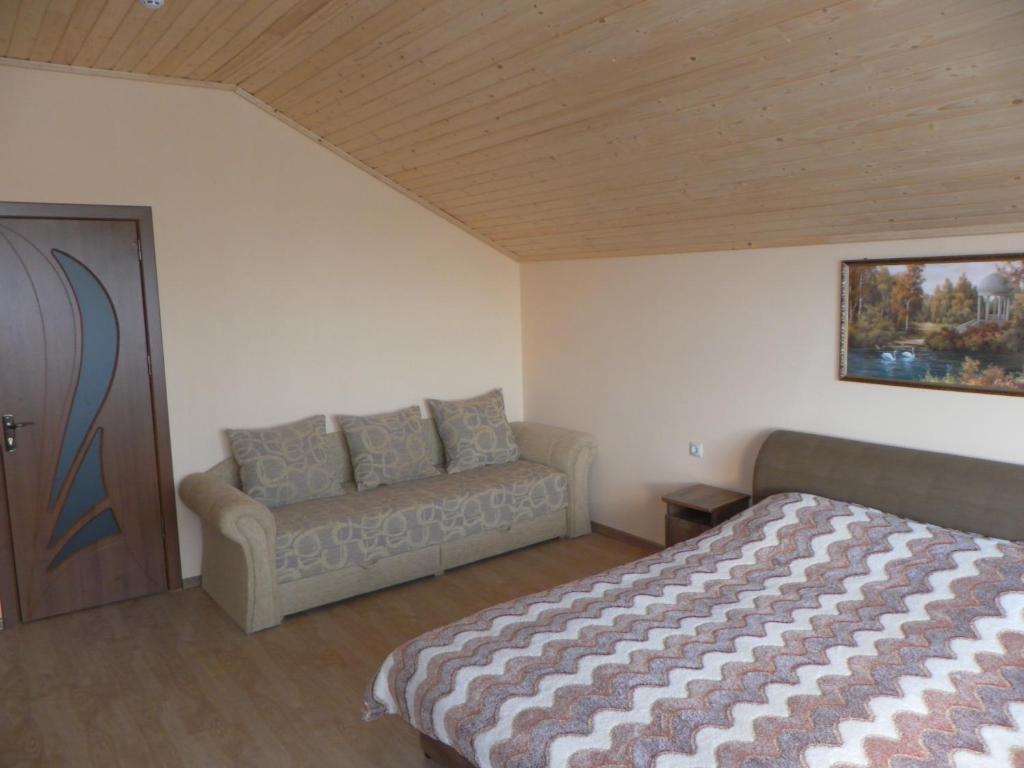 Postel nebo postele na pokoji v ubytování Котедж Silvia