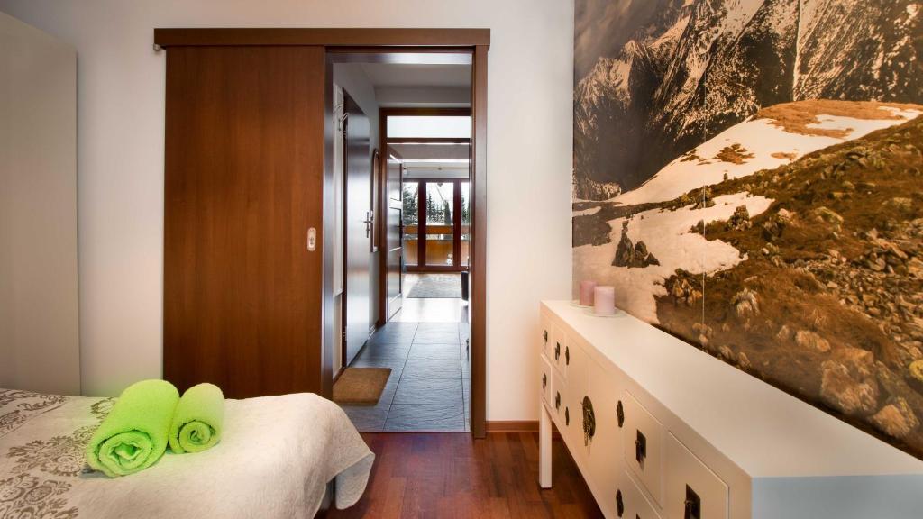Posteľ alebo postele v izbe v ubytovaní Apartament Wolny Czas