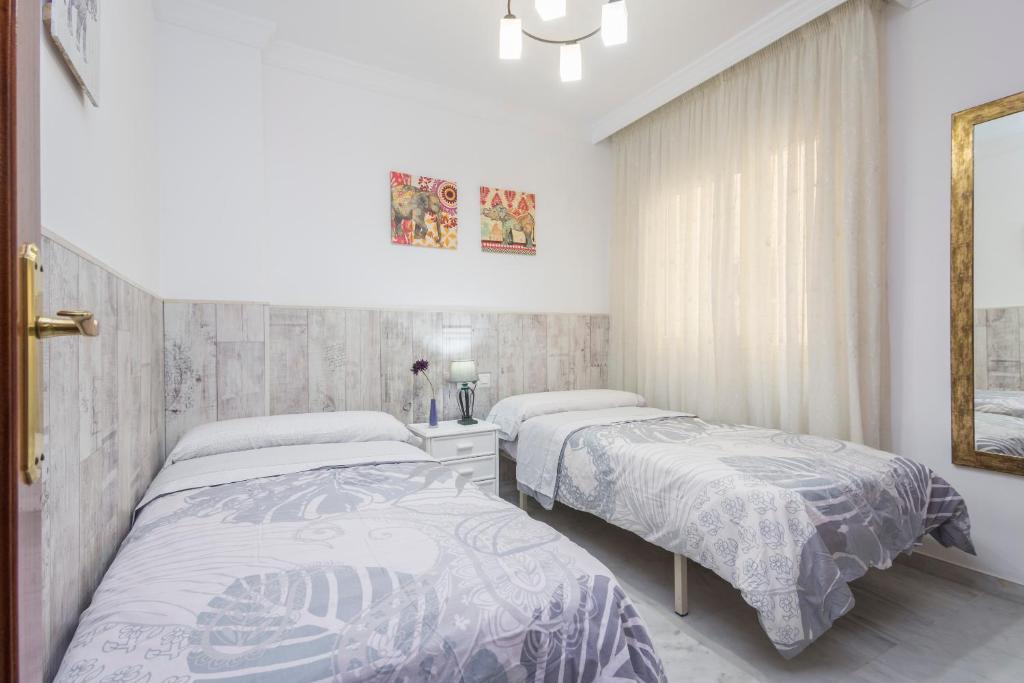 Postel nebo postele na pokoji v ubytování Apartamento Alaska 800 m de la Playa Parking Privado