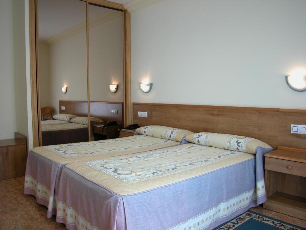 Posteľ alebo postele v izbe v ubytovaní Hotel Cachada
