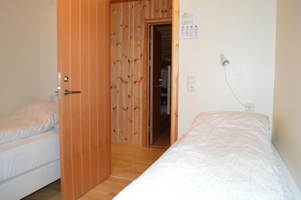 Ένα ή περισσότερα κρεβάτια σε δωμάτιο στο Laugarfell Accommodation & Hot Springs