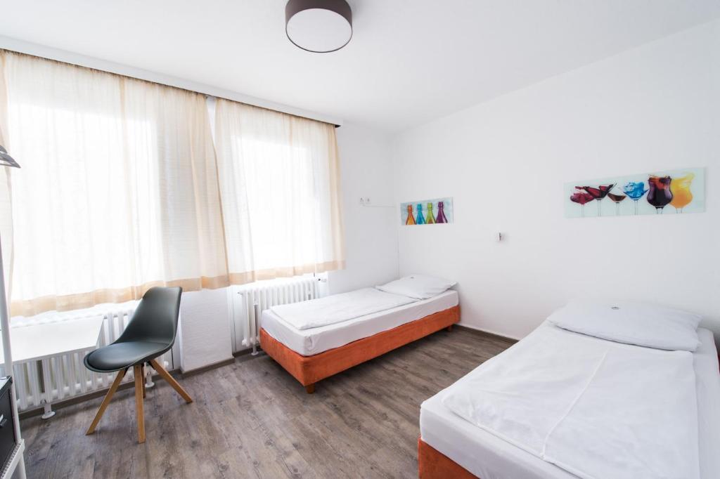 Postel nebo postele na pokoji v ubytování SOVA Hotel