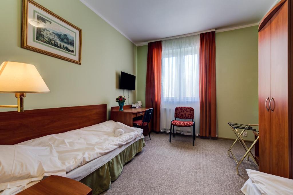 Posteľ alebo postele v izbe v ubytovaní Villa Plaza