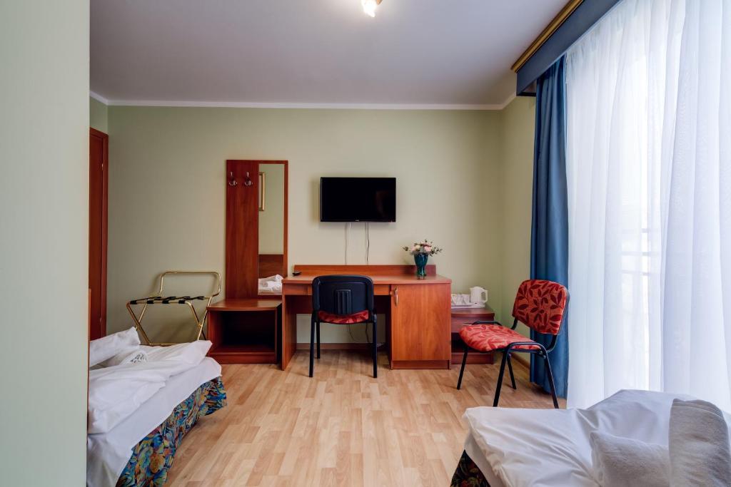 Posteľ alebo postele v izbe v ubytovaní Villa Plaza