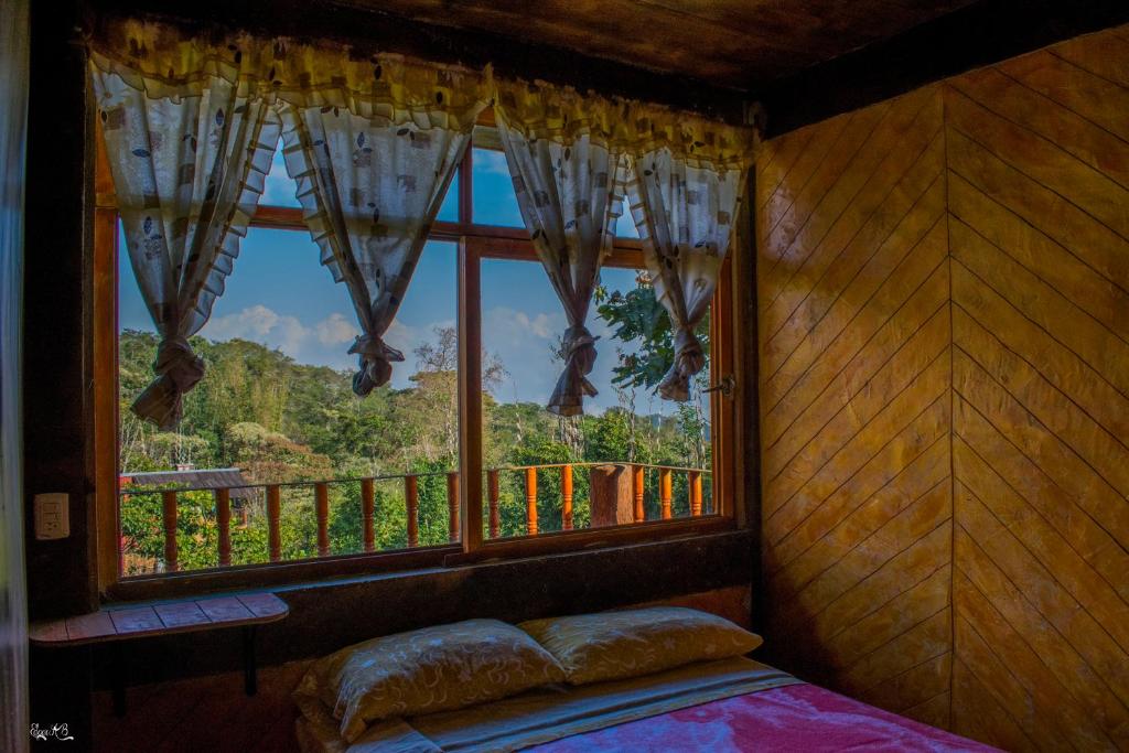 Postel nebo postele na pokoji v ubytování Cabañas los Cedros