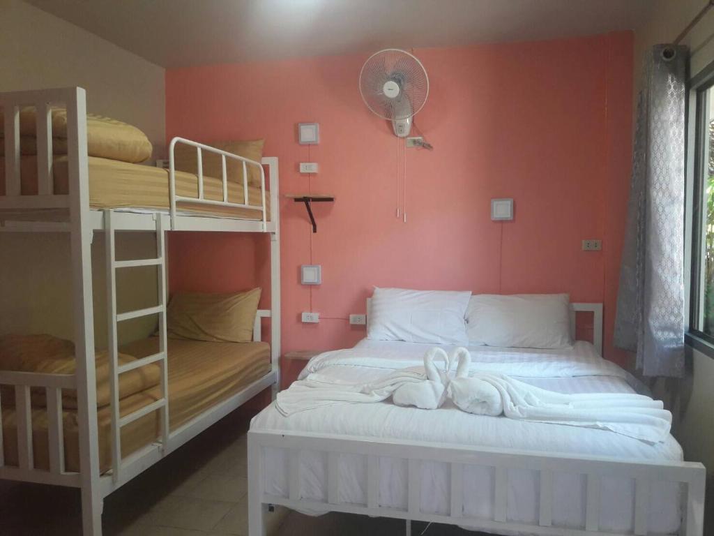 Postel nebo postele na pokoji v ubytování Thapae Gate Lodge