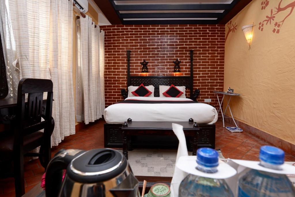 Postel nebo postele na pokoji v ubytování Kasthamandap Boutique Hotel