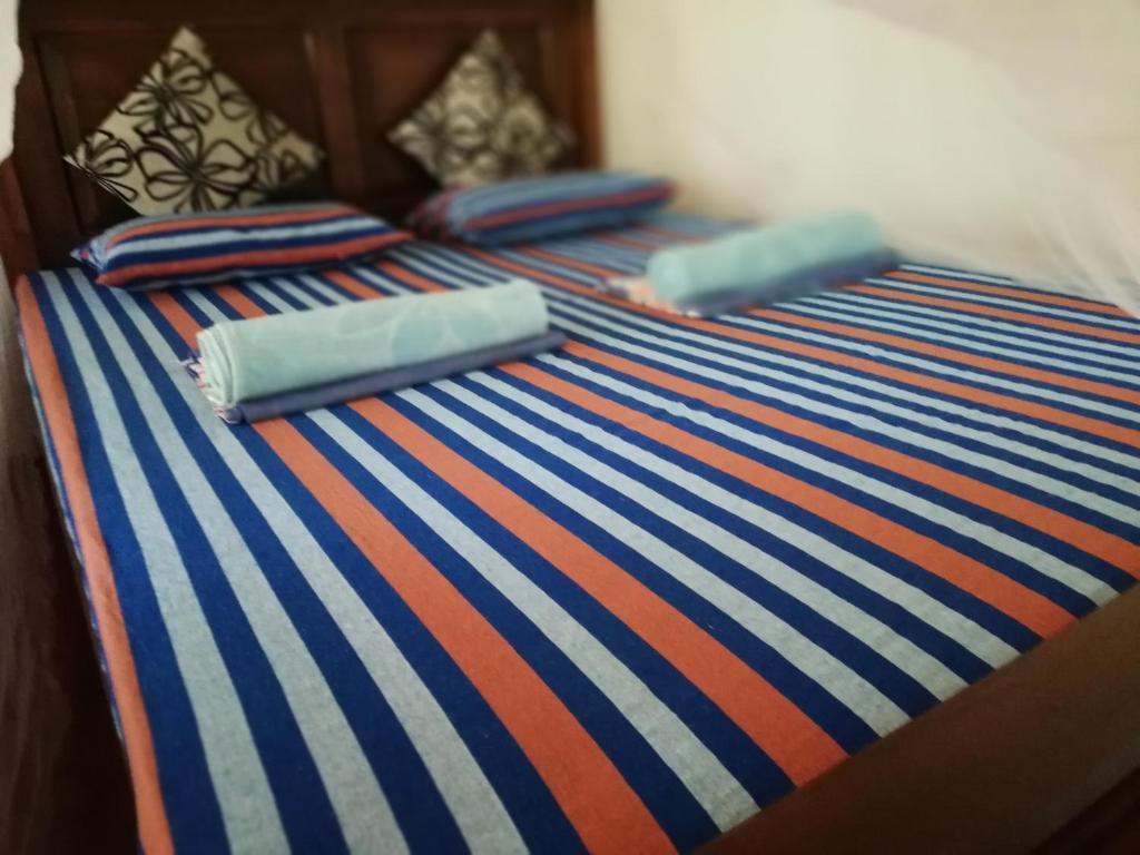 Postel nebo postele na pokoji v ubytování Bay Hill Guest House