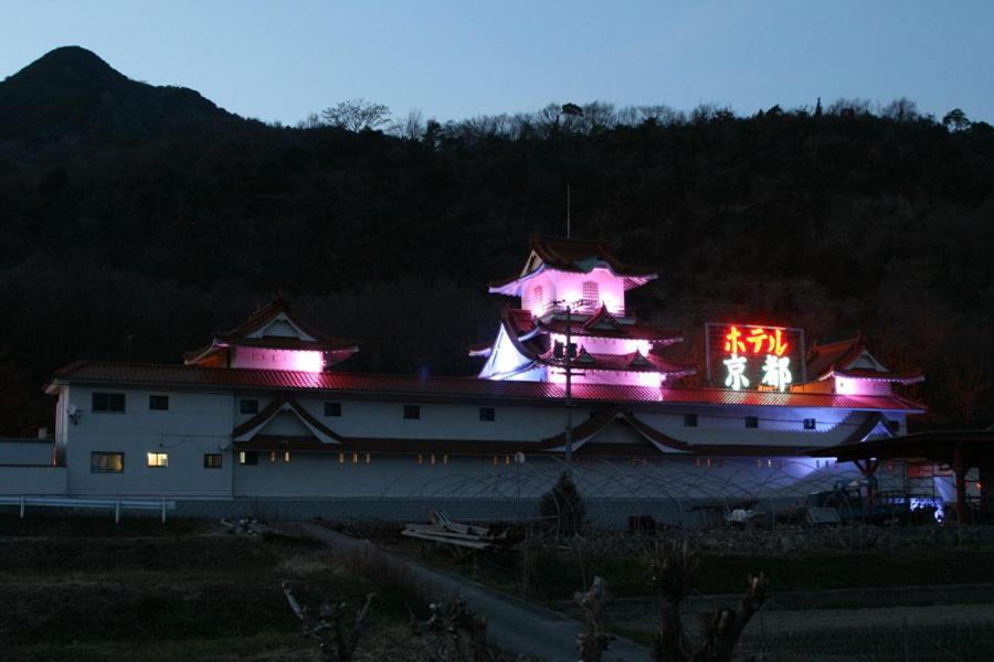 a building with pink lights on top of it at Hotel Kyoto (Adult Only) in Zentsuji