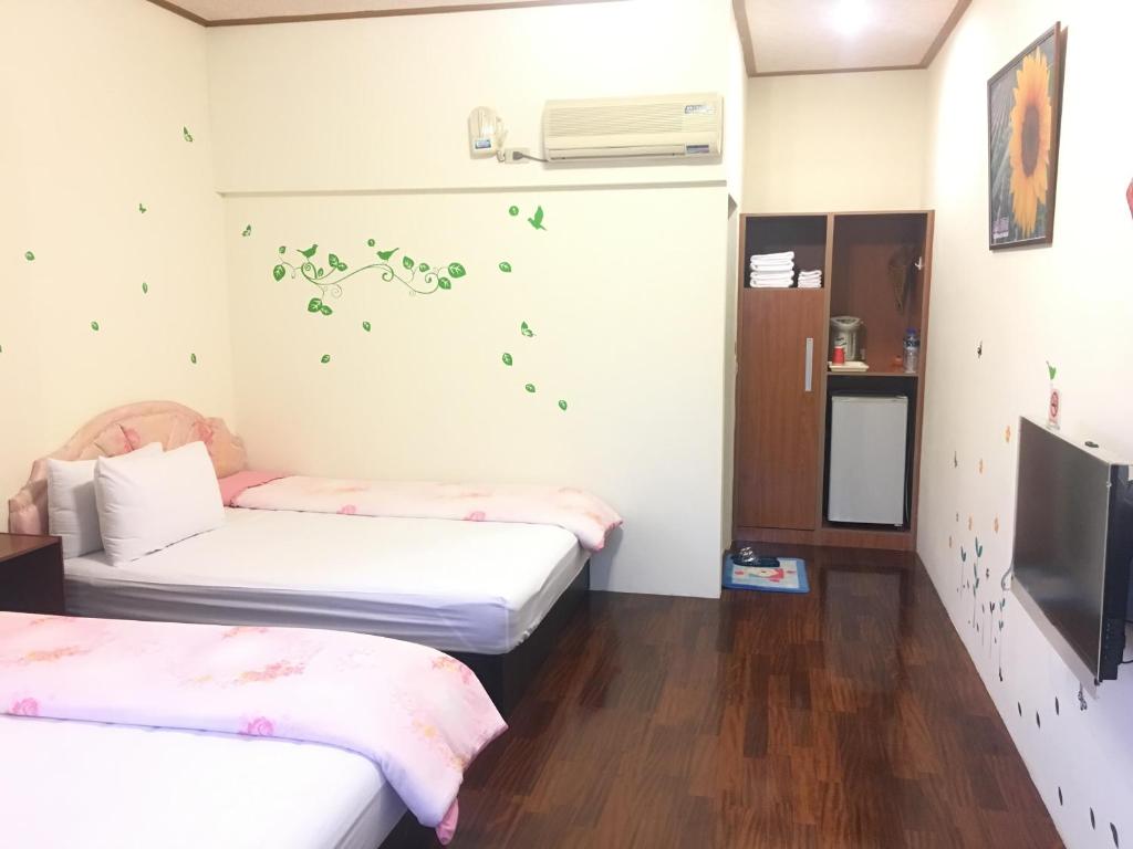 Postel nebo postele na pokoji v ubytování Chin Shan B&B