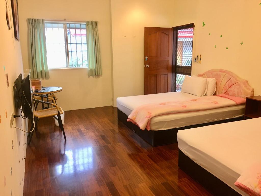 Postel nebo postele na pokoji v ubytování Chin Shan B&B