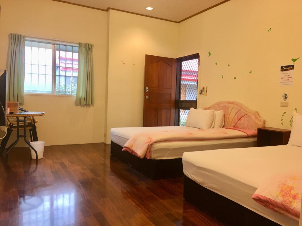 Postel nebo postele na pokoji v ubytování Chin Shan B&B