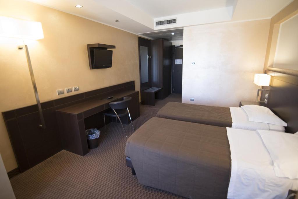 Voodi või voodid majutusasutuse E' Hotel toas
