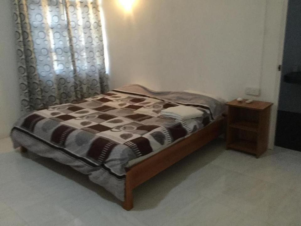 Postel nebo postele na pokoji v ubytování Skipper Dan Bungalow