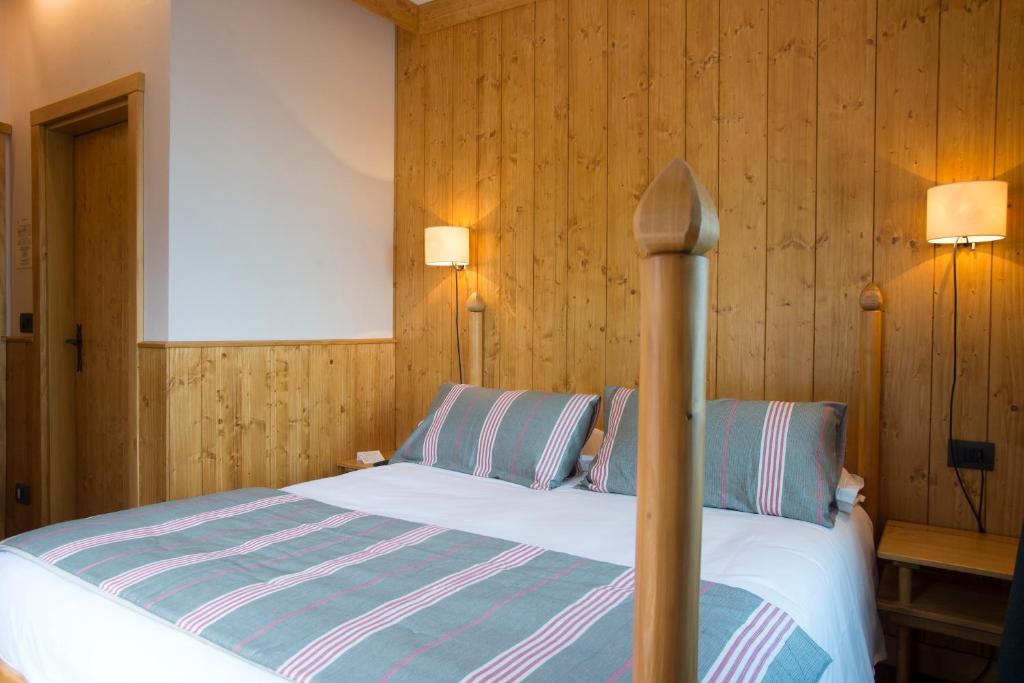 Postel nebo postele na pokoji v ubytování Albergo Ristorante Bucaneve