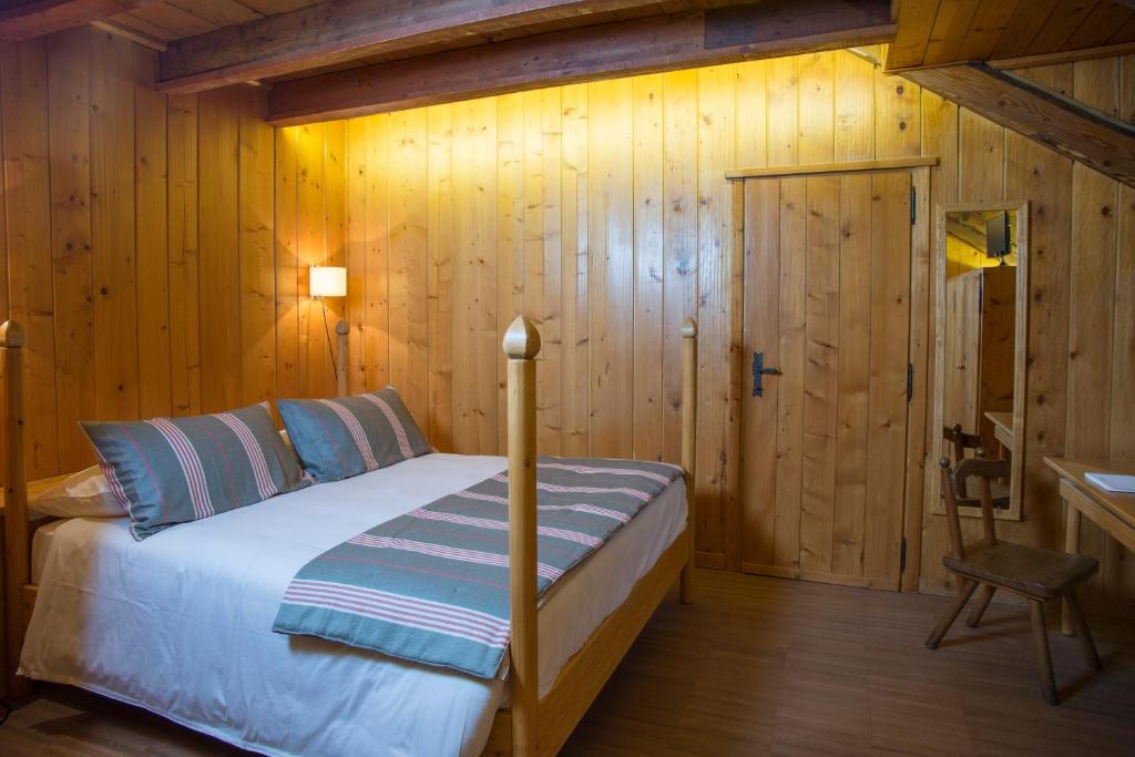 Postel nebo postele na pokoji v ubytování Albergo Ristorante Bucaneve
