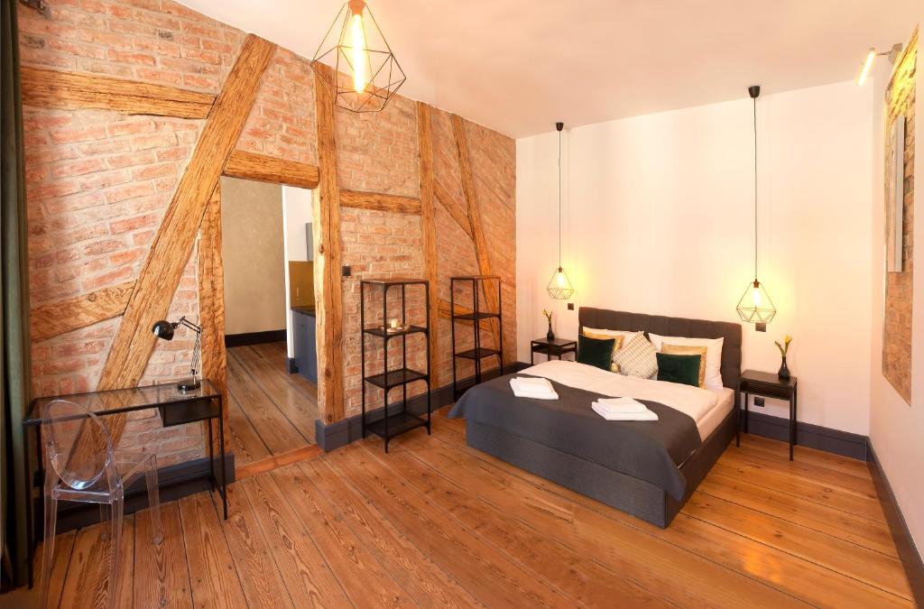 Posteľ alebo postele v izbe v ubytovaní Apartamenty "BULWAR GORZOW"