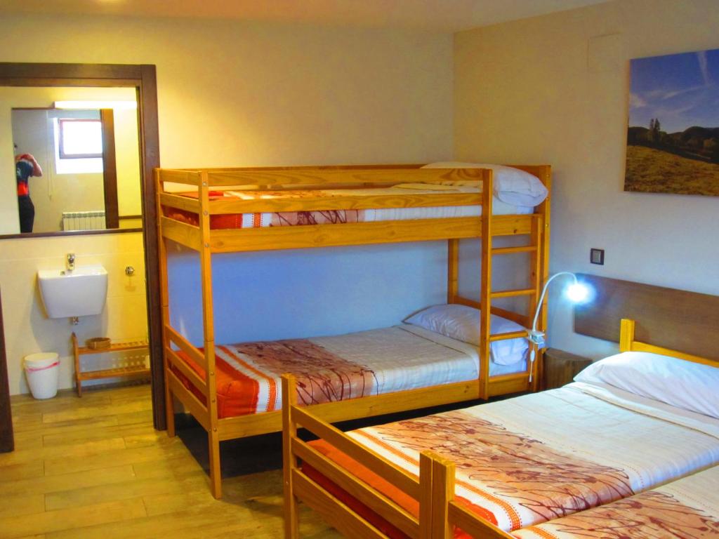 Postel nebo postele na pokoji v ubytování Matxitxulo Family Rooms