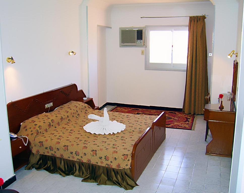 Postel nebo postele na pokoji v ubytování Sara Hotel Aswan