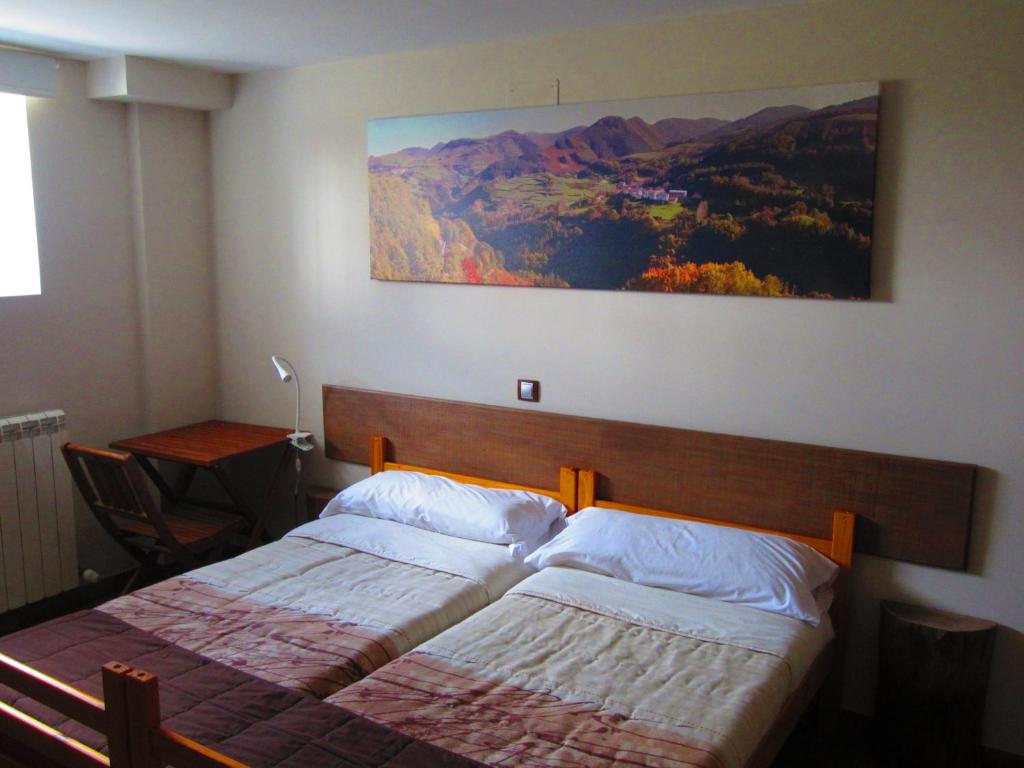Postel nebo postele na pokoji v ubytování Matxitxulo Family Rooms