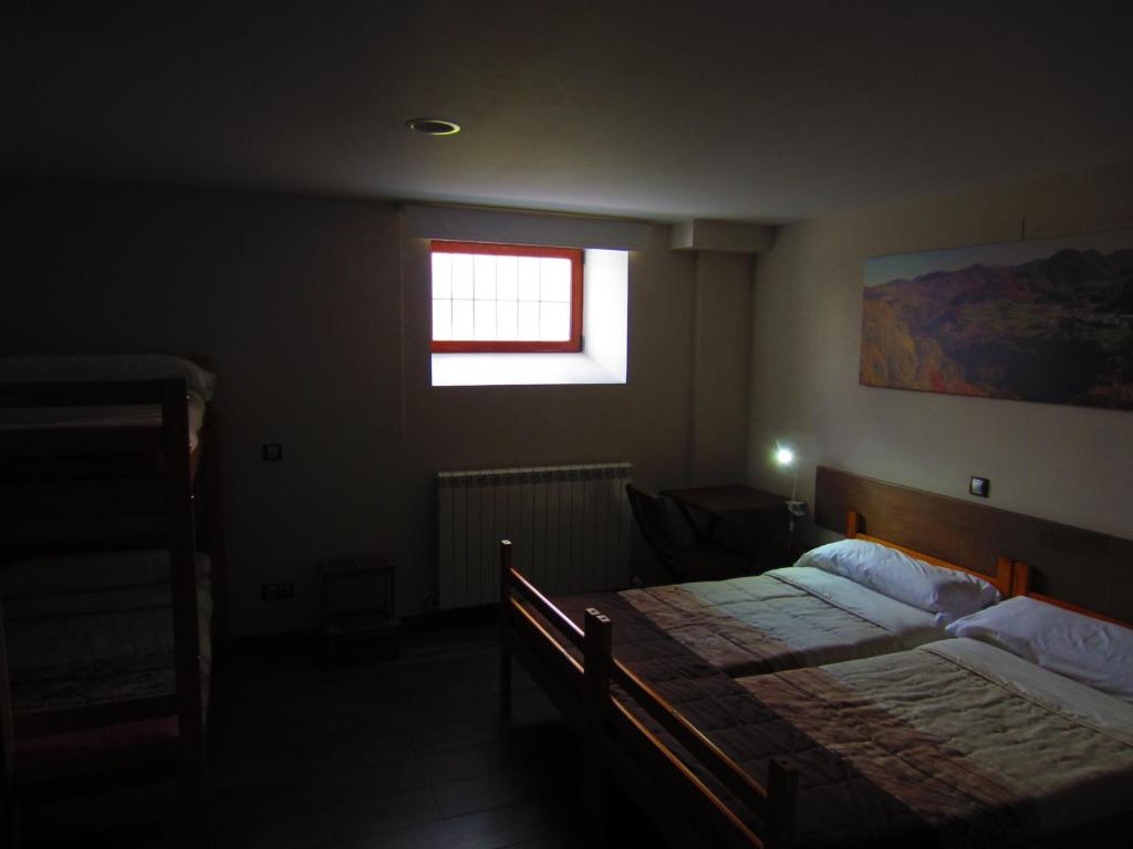 Postel nebo postele na pokoji v ubytování Matxitxulo Family Rooms