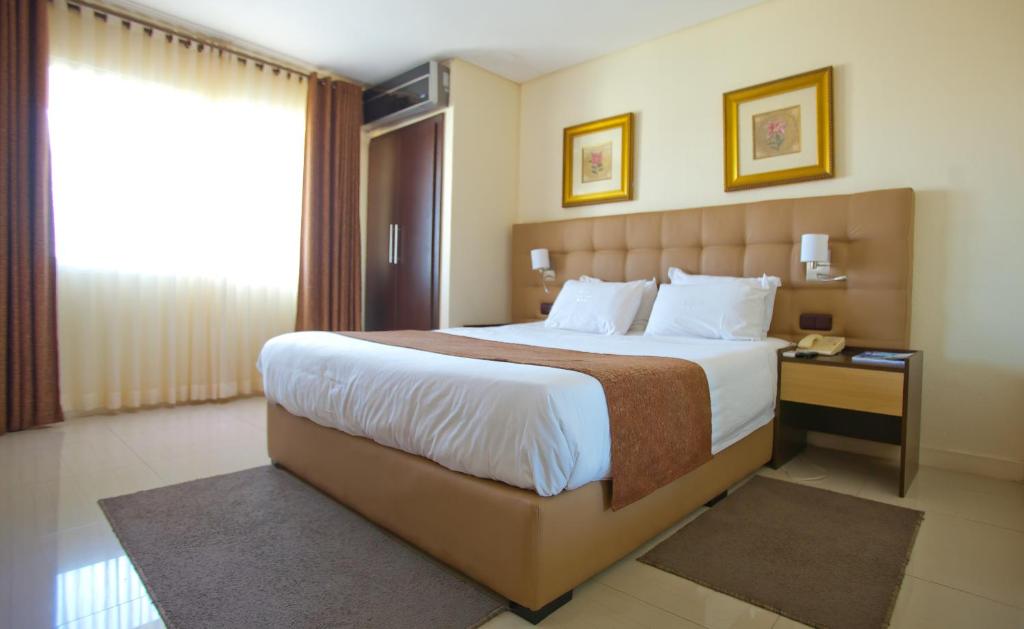 Postel nebo postele na pokoji v ubytování Hotel Monte Carlo