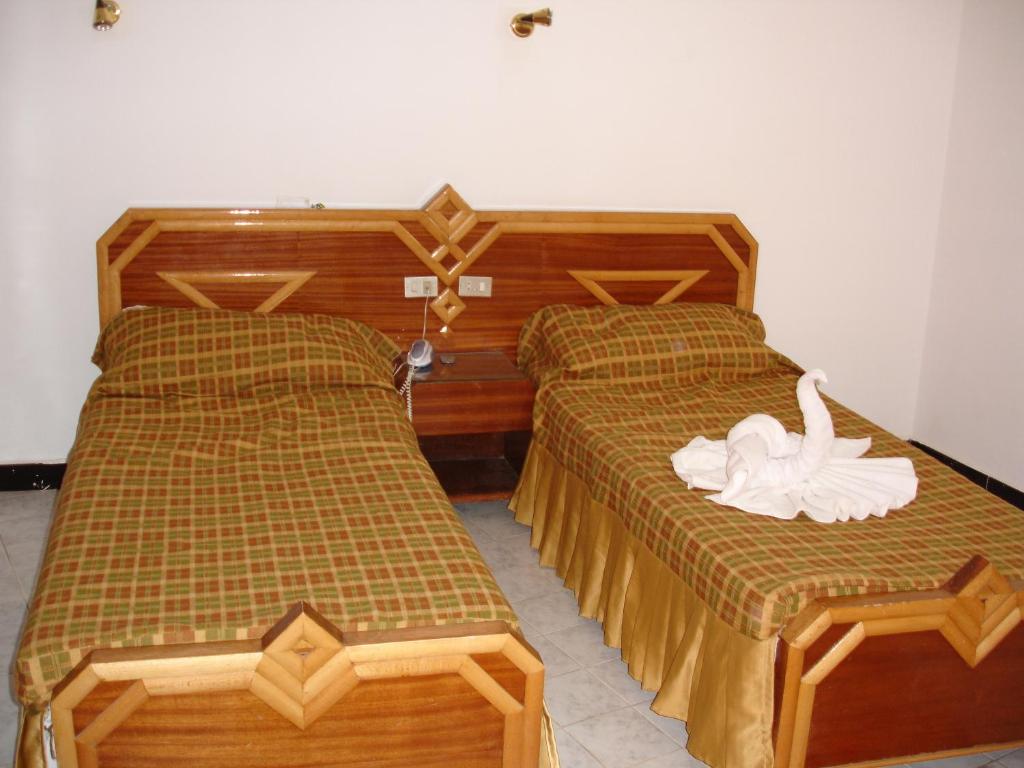Postel nebo postele na pokoji v ubytování Sara Hotel Aswan