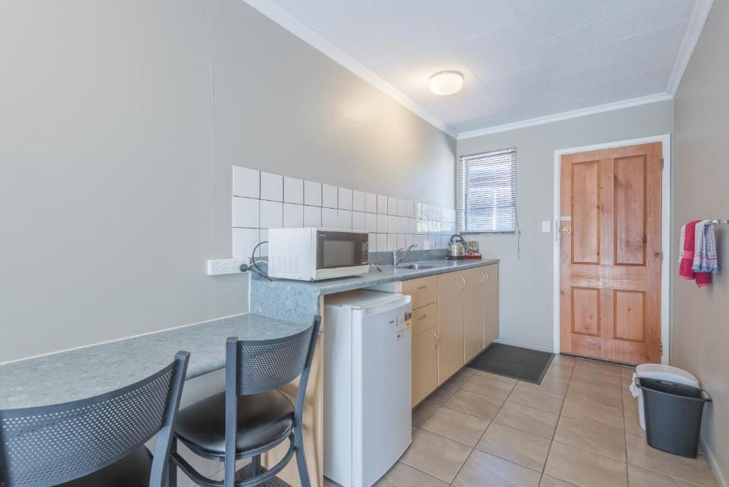 Kuchyň nebo kuchyňský kout v ubytování Manuka Crescent Motel