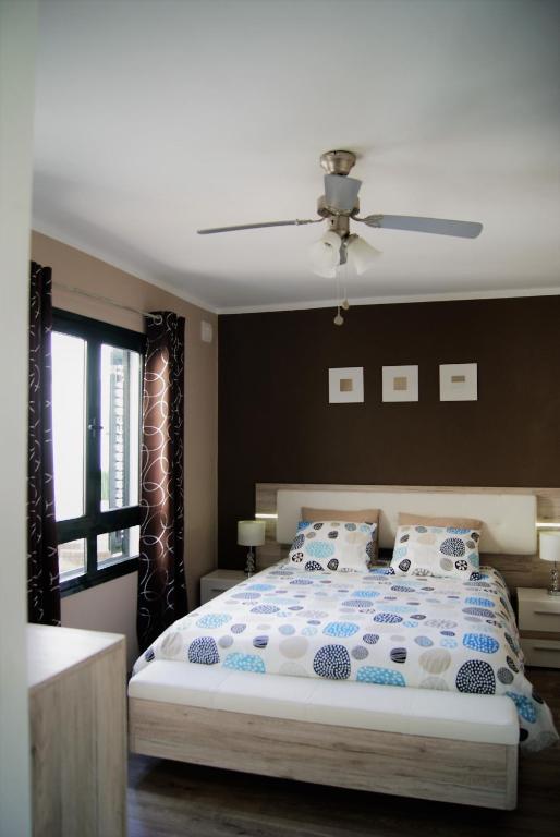 Posteľ alebo postele v izbe v ubytovaní Bungalow Naïla