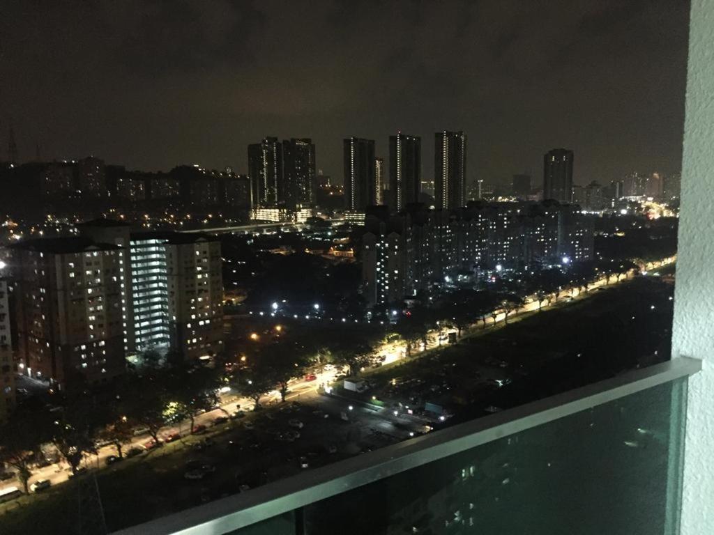 a view of a city at night with lights at JV HOMESTAY - 2 Rooms Condominium Home Stay at Jalan Klang Lama in Kampong Bohol